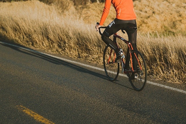 Halfbody shot of a male Riding Road Bike