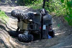 An ATV on its side after an ATV accident involving a child