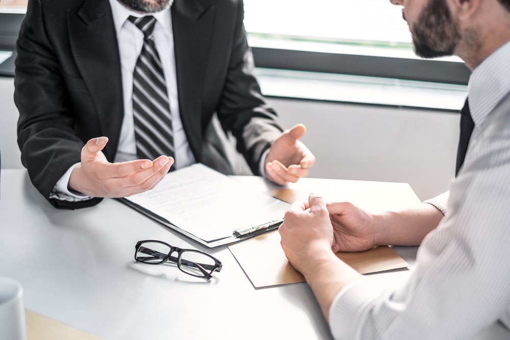 A bad faith insurance attorney talking to a client in Boulder