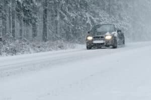 A car driving during a snowstorm in Boulder